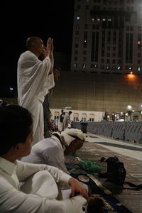 High angle view of men praying on the street of mecca.