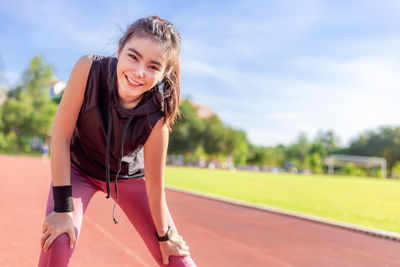 Portrait of smiling girl standing outdoors