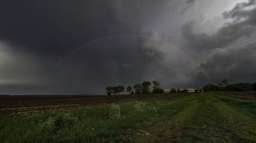 Scenic view of storm clouds over land