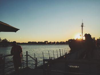 People in water at sunset