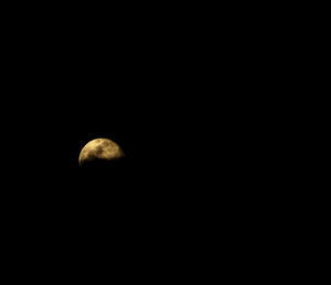 Low angle view of moon against sky at night