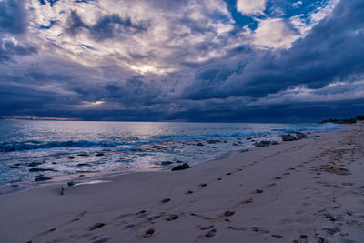 Scenic view of beach against sky during sunset