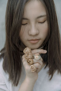 Close-up of young woman with jewelry