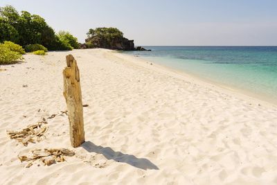 Scenic view of beach against clear sky