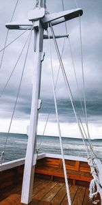 Sailboat on sea against sky