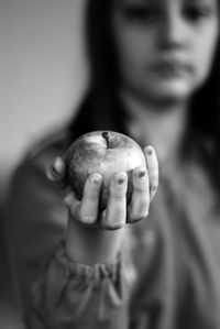 Close-up of woman holding apple