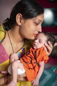 Close-up of mother and daughter at home