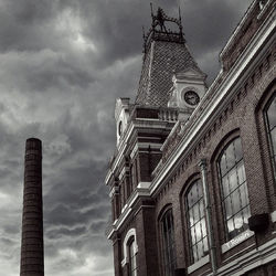 Low angle view of cathedral against cloudy sky