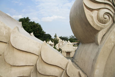 Low angle view of statue against sky