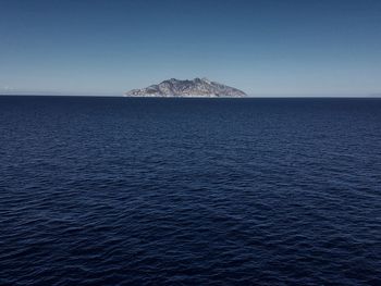 Scenic view of sea against clear blue sky