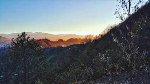 Scenic view of landscape against sky at sunset