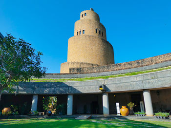 Low angle view of historical building against blue sky