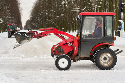 Side view of vehicle on road in winter