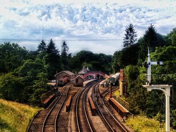 High angle view of train amidst trees against sky