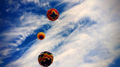 Hot air balloons gliding effortlessly through the wind 