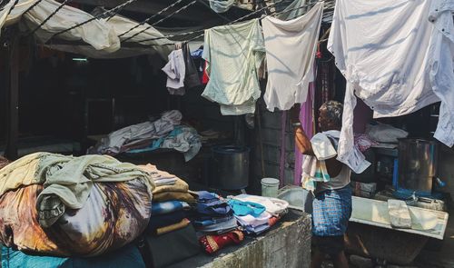 Clothes hanging on rack at market
