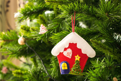 Close-up of christmas decorations hanging on tree