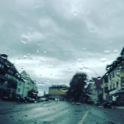 Close-up of rain drops on car window