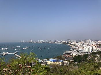 High angle view of city by sea against clear sky at pattaya. thailand 