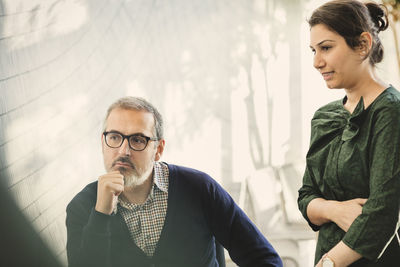 Multi-ethnic creative people attending business meeting in office