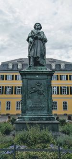 Low angle view of statue against building