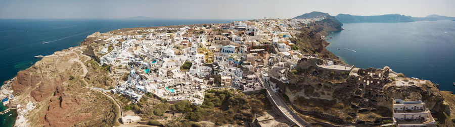 High angle view of sea and mountains against sky