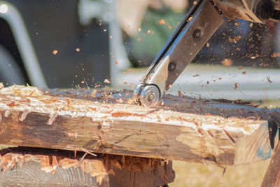 Close-up of equipment on wooden sculpture