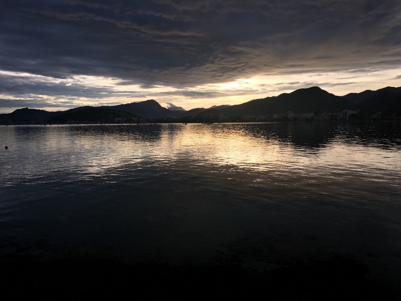 water, sky, silhouette, sunset, tranquil scene, scenics, reflection, tranquility, lake, beauty in nature, cloud - sky, rippled, waterfront, nature, idyllic, cloud, mountain, sea, dusk, river