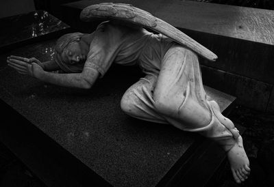 Low section of man sitting on floor