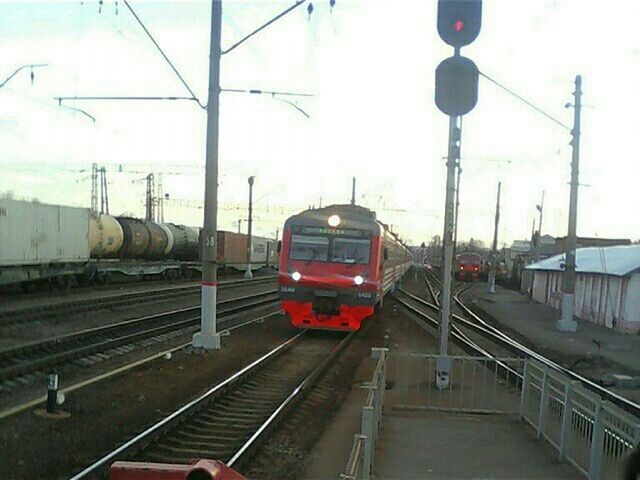 railroad track, transportation, rail transportation, public transportation, railroad station platform, train - vehicle, railroad station, mode of transport, passenger train, train, travel, public transport, railway track, railway station, journey, on the move, sky, railway station platform, power line, built structure