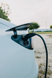Close-up of electric car charging
