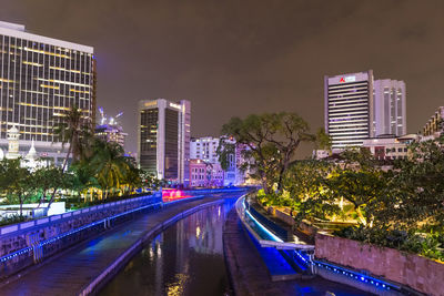 View of illuminated buildings in city at night