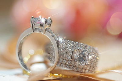 Close-up of wedding rings on table