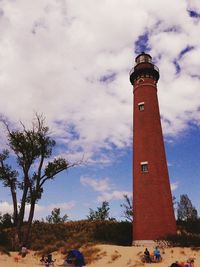 Lighthouse against cloudy sky