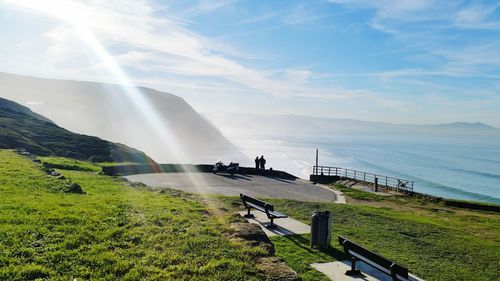 Scenic view of mountain and sea against sky