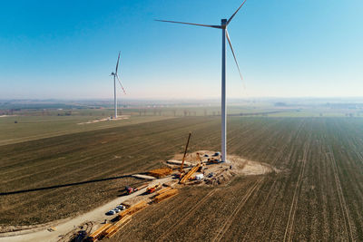 Construction site near windmill turbine, wind generator installing