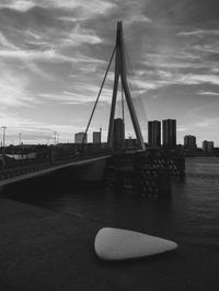 View of bridge over river against sky in city