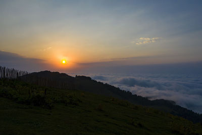 Scenic view of landscape against sky during sunset