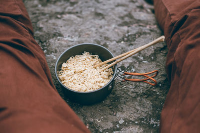 Close-up of hand holding bowl