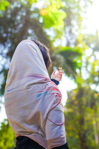 Side view of woman standing outdoors