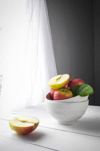 Close-up of fruits in bowl on table