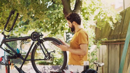 Side view of boy riding bicycle