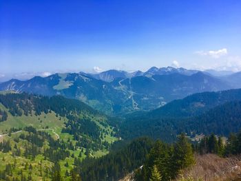 Scenic view of mountains against clear blue sky