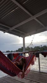 Low angle view of man relaxing on boat