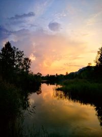 Scenic view of lake against sky during sunset