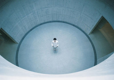 High angle view of woman sitting in swimming pool