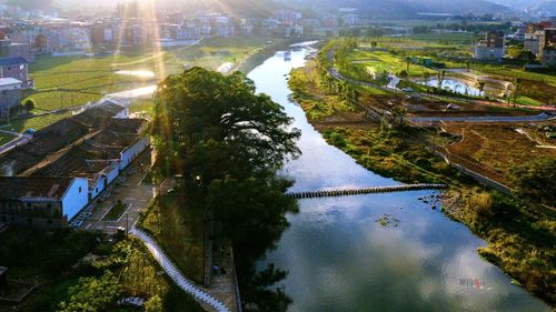 High angle view of river amidst buildings in city