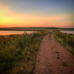 Road passing through field