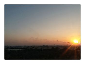 Scenic view of sea against clear sky during sunset