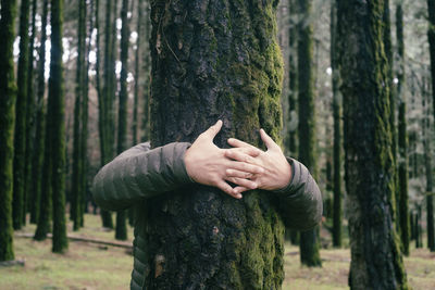 Woman standing in forest